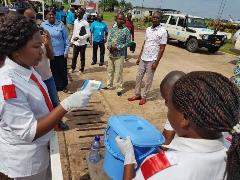 A health worker using remote temperature meter in the Democratic Republic of the Congo
