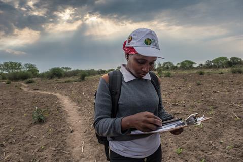 a census worker collects important data from citizens in Mozambique
