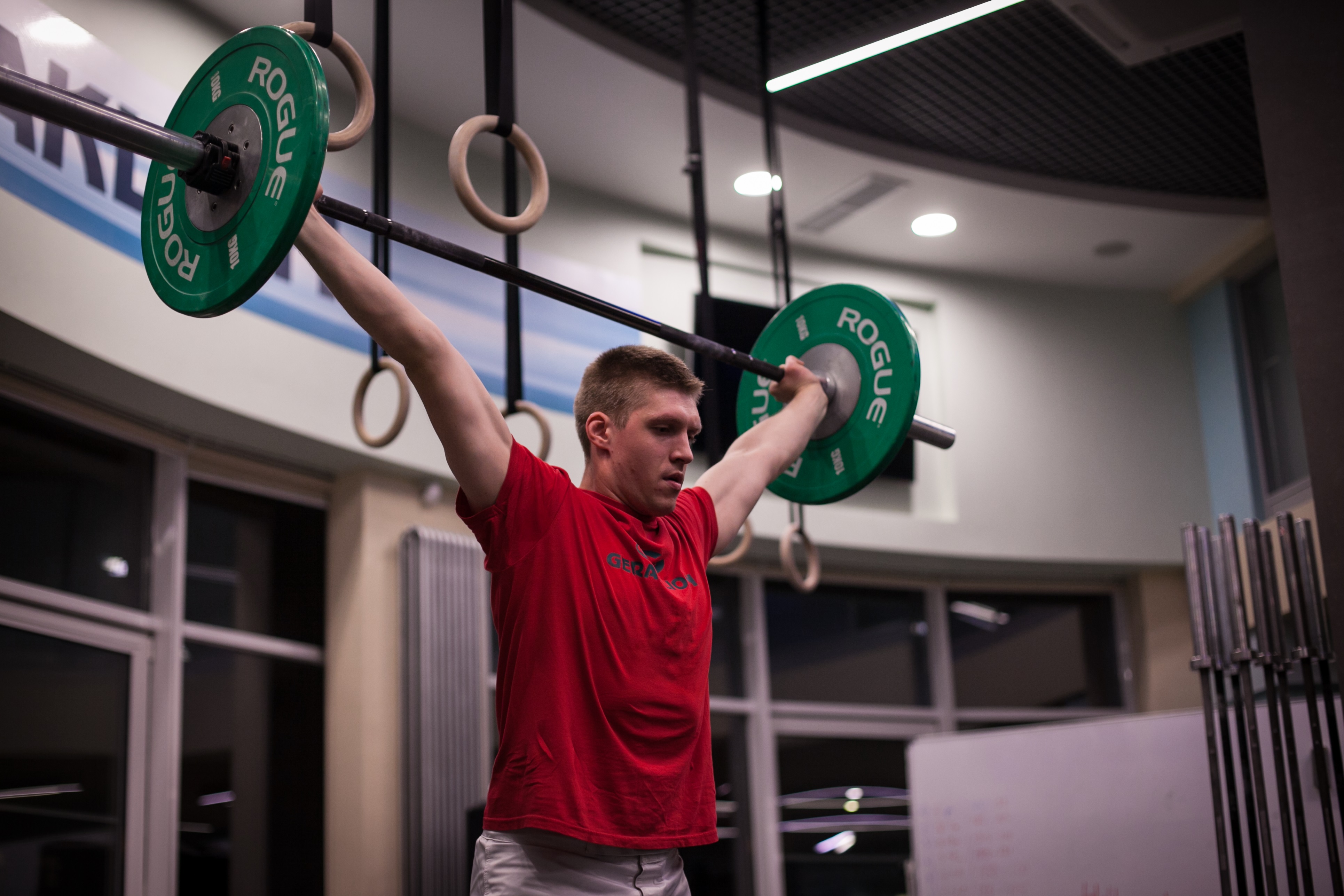 A man in Russia lifting weights in a gym