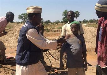 An old man in Tanzania, having his blood pressure checked