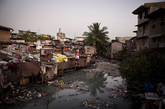 poverty area, houses and waste product, Philippines