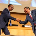 Paul Kagame and Dr Tedros shake hands