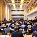 A meeting room filled with people at Palais des Nations
