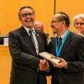 WHO Director-General Dr Tedros shares a laugh at the World Health Assembly.
